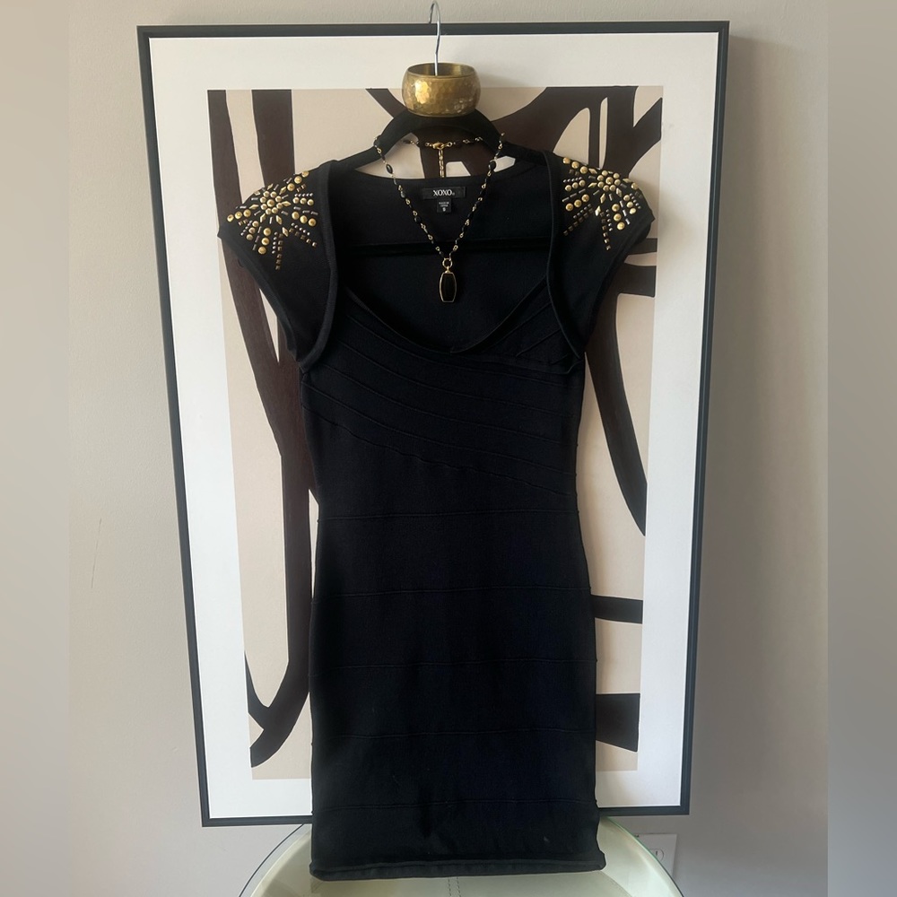 Black XOXO  slim fitted above the knee dress with gold beaded details.Super Sexy